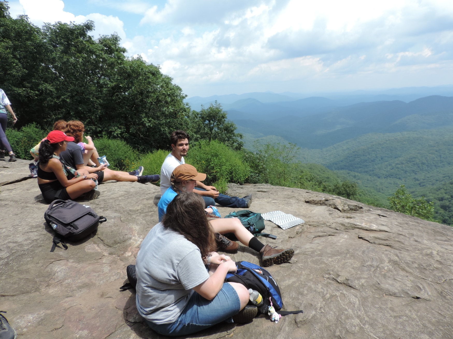 Students on a mountain top hiking