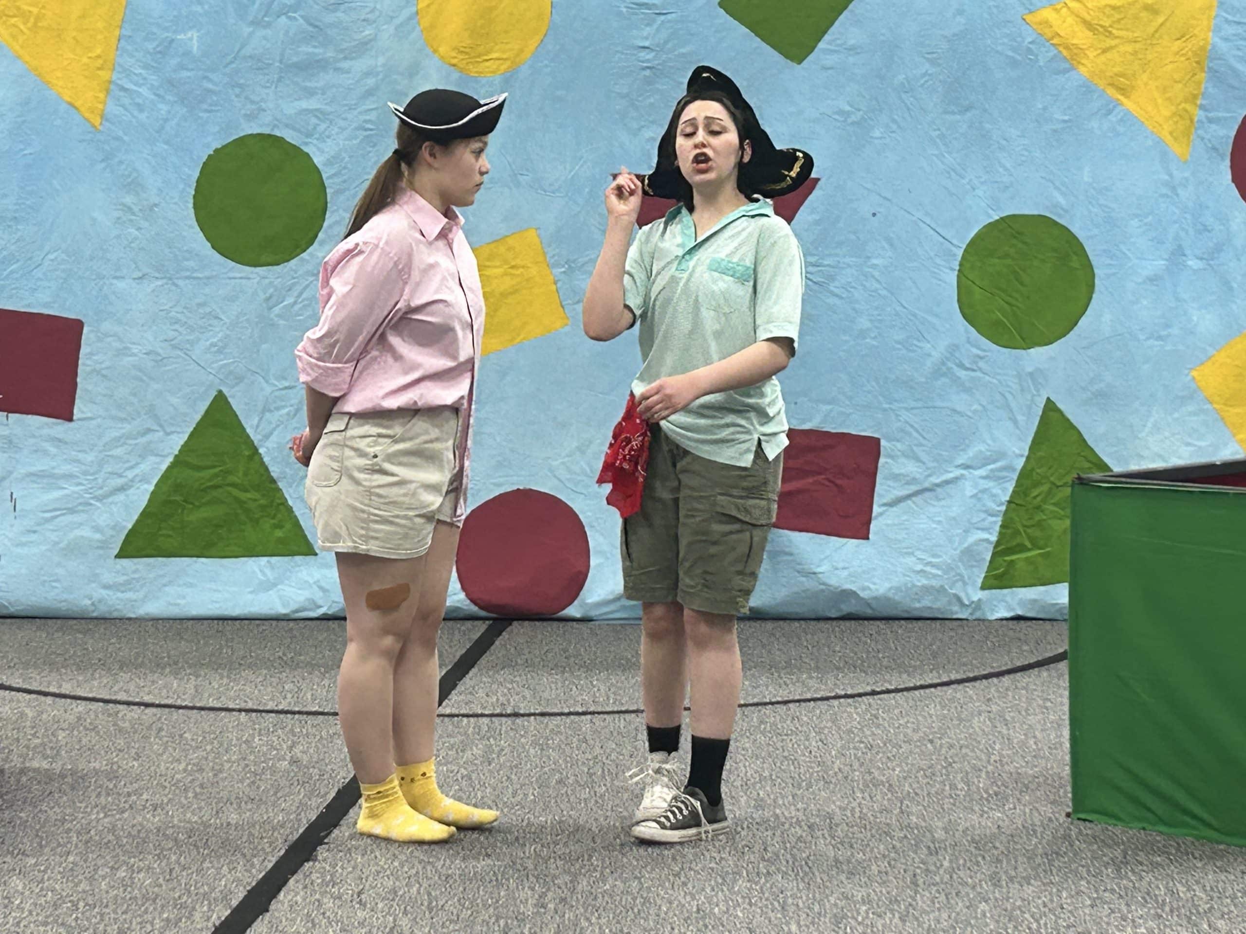Two students performing a scene