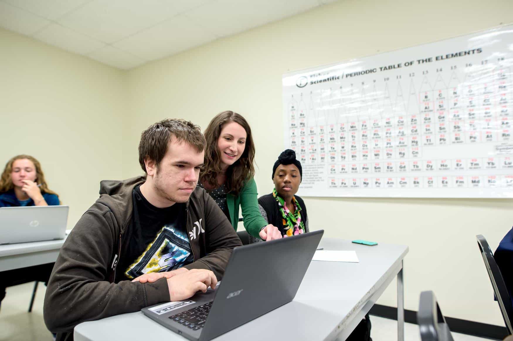 Chemistry Education professor assisting Chemistry Ed students