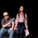 Students acting out a scene for drama education