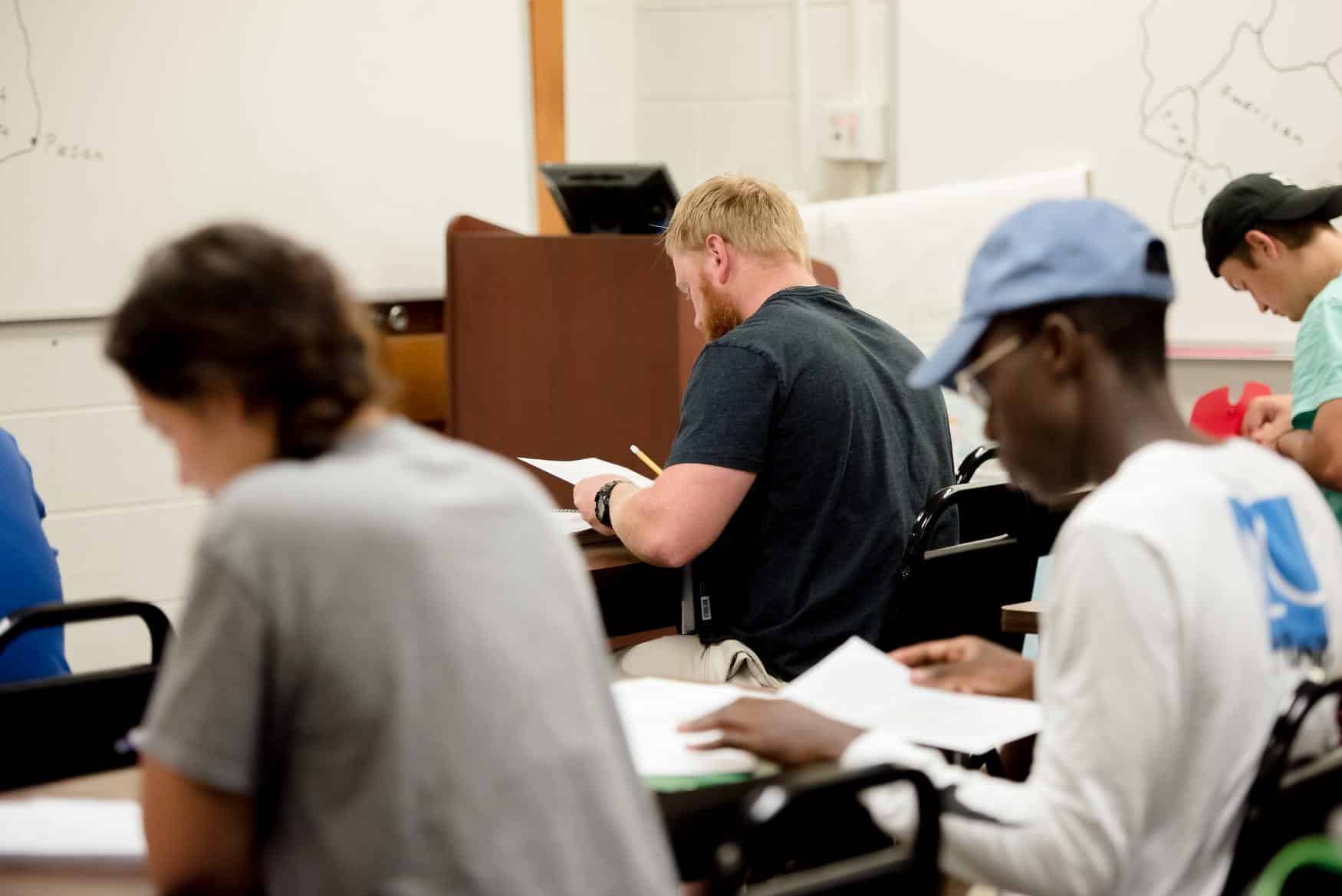 Students intently reading during a history class.