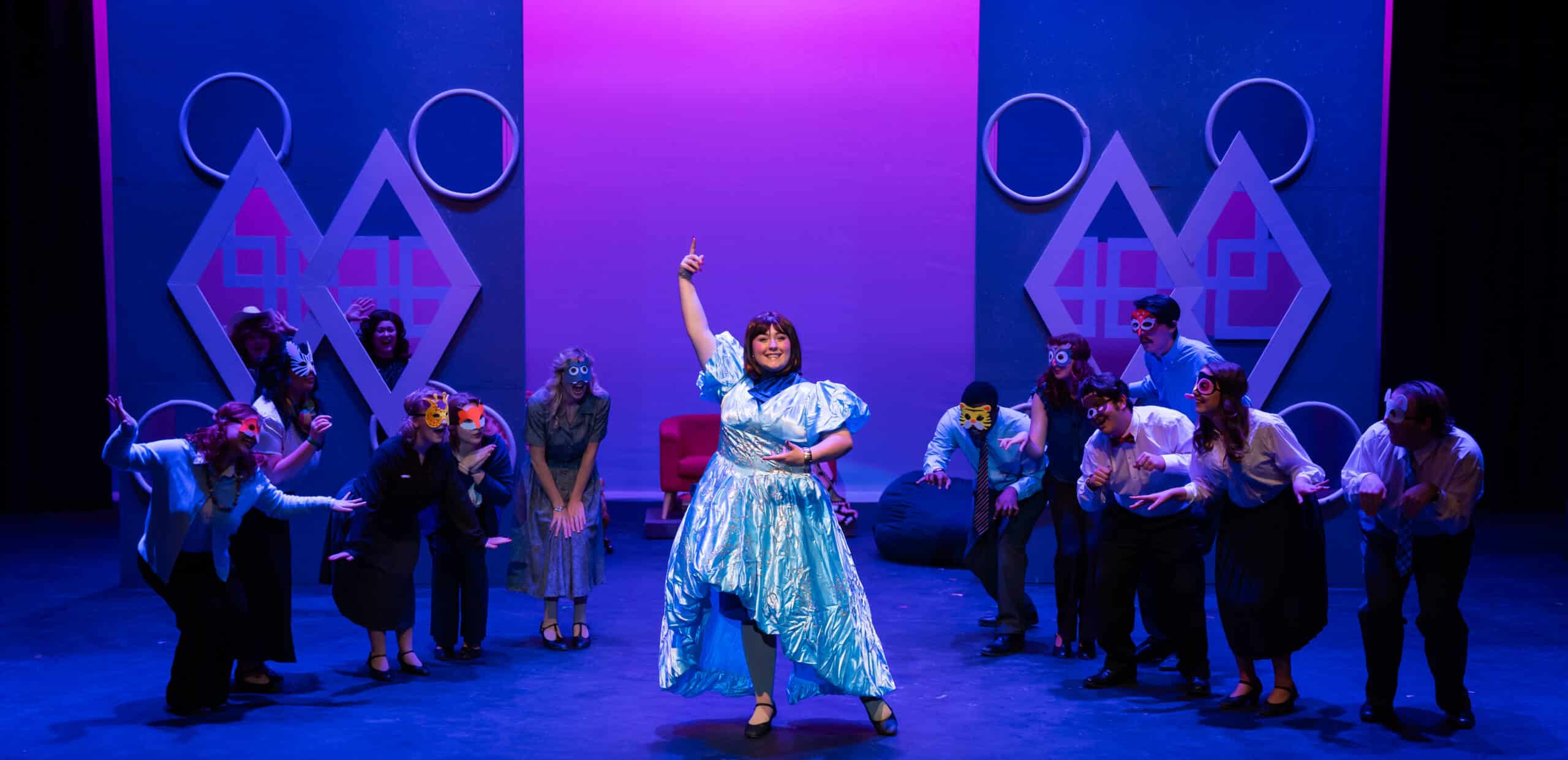 Performers onstage wearing animal masks.