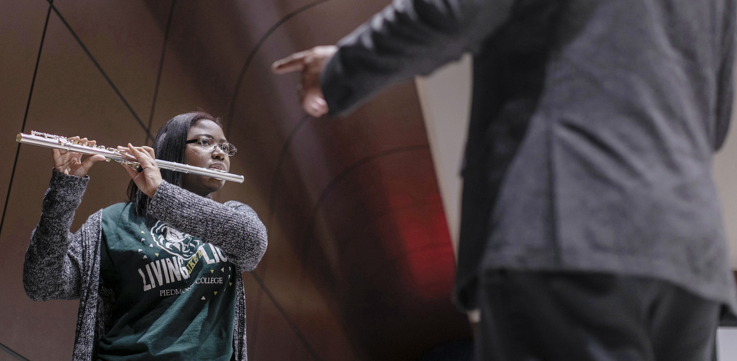 student playing flute