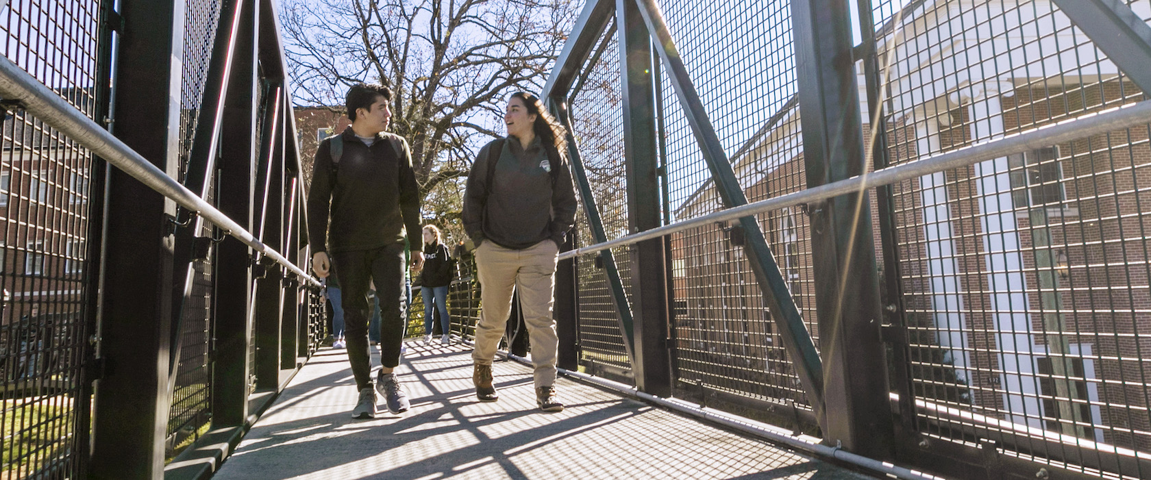 students on pedestrian bridge