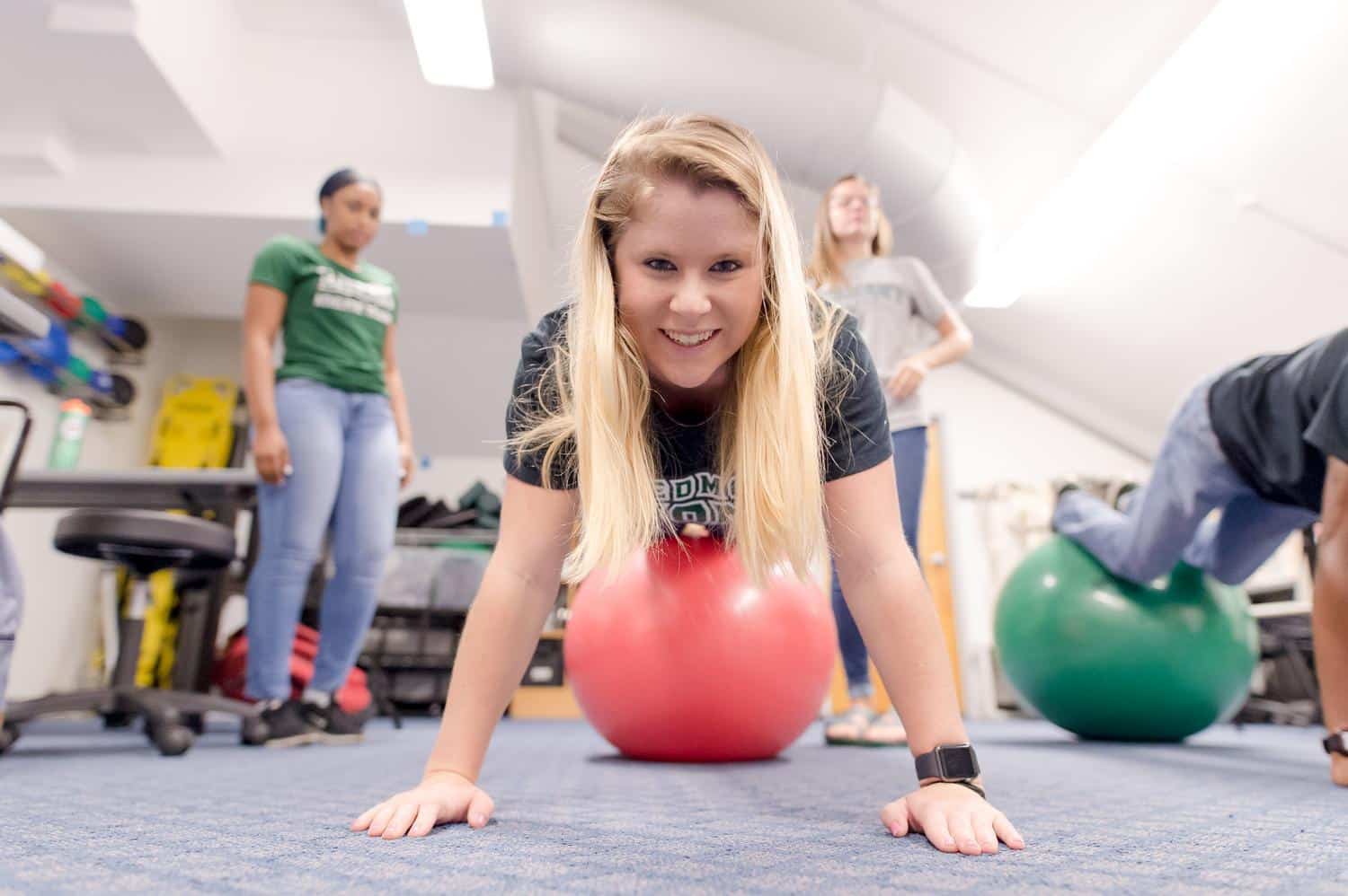 athletic training student on ball