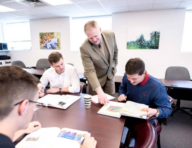 business professor explaining topic to student