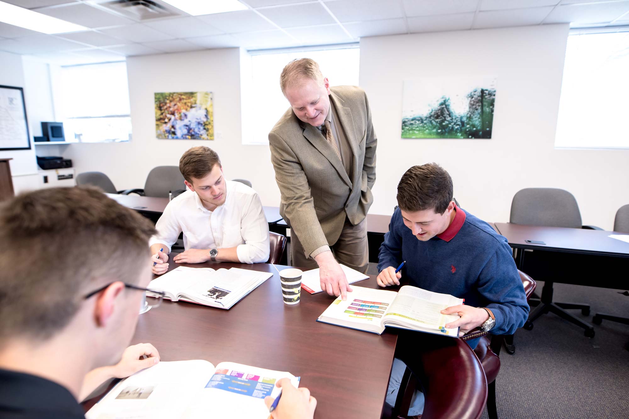 business professor explaining topic to student