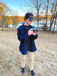 Photo of Tyler Goins using his camera.