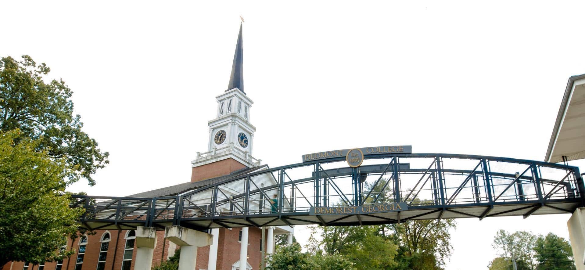 The Piedmont College pedestrian bridge can be seen in the foreground, with the Chapel visible in the background.