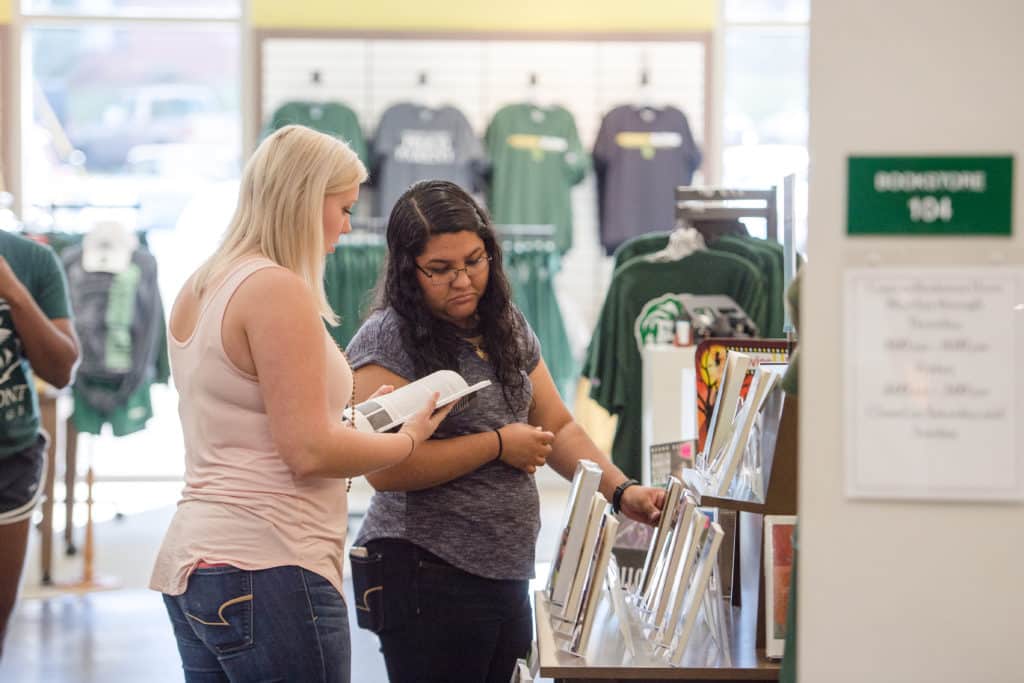 Two students browsing through the Piedmont bookstore