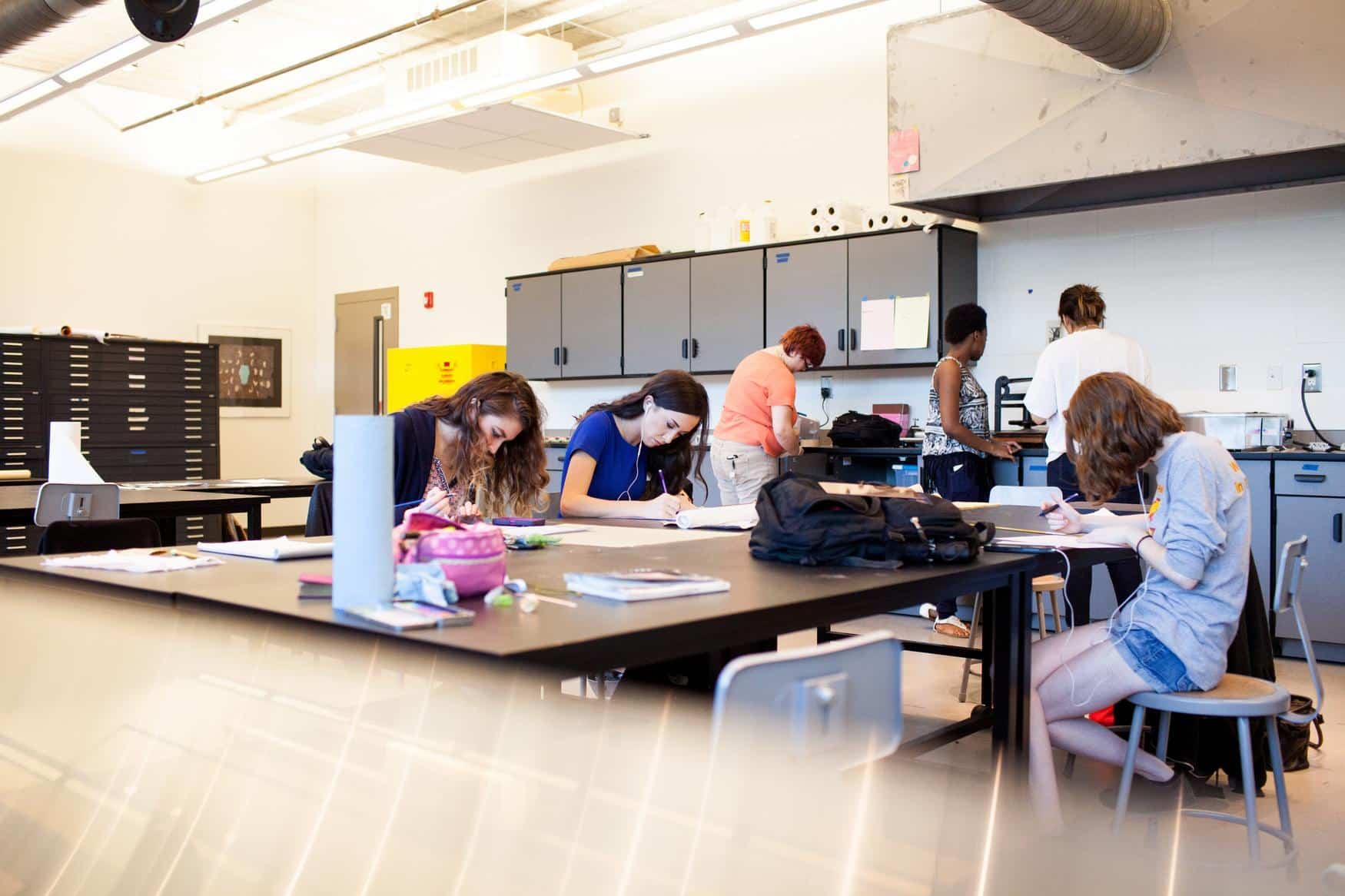 Students at tables in a classroom