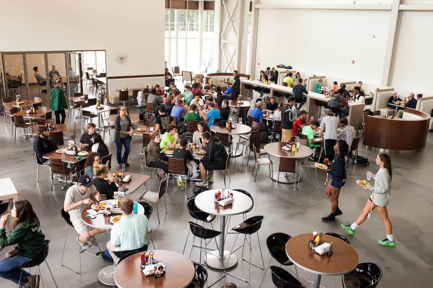 Overhead view of the dining hall full of students eating and going about their days.
