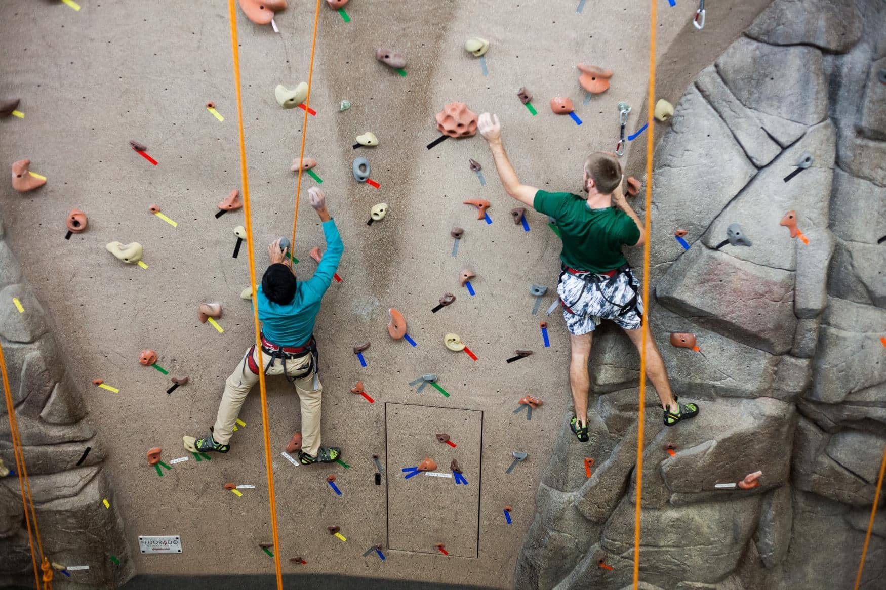 Two students rock climbing.