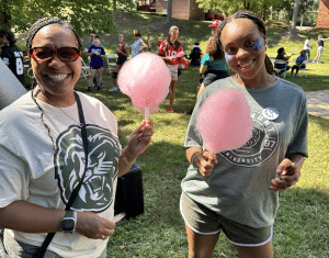 Two women holding cotton candy