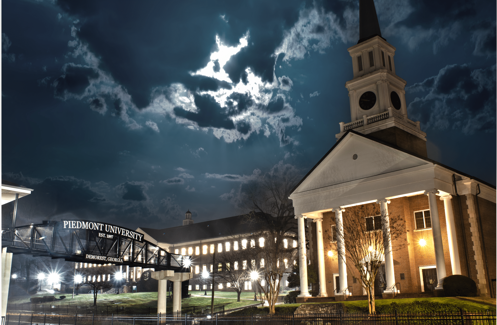 Night time view of the Piedmont chapel with moon and cloud cover