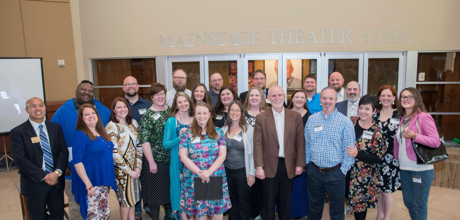 Piedmont Alumni standing in front of the Mainstage Theater