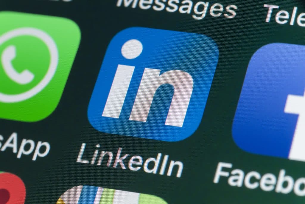London, UK - July 31, 2018: The buttons of LinkedIn, Facebook, Messages and other apps on the screen of an iPhone.