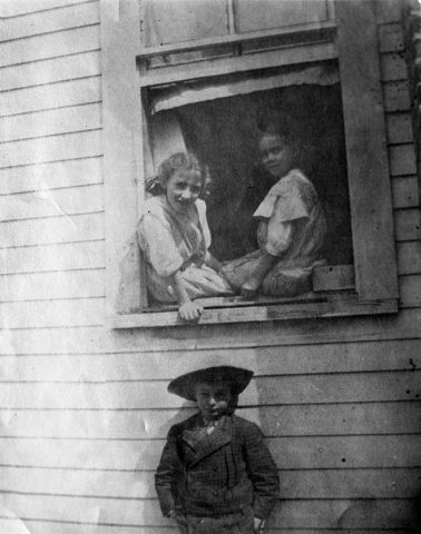 LES-1 Lillian Smith and childhood friend Marjorie White in window; Wombolt Paulk underneath window in Jasper, Florida; courtesy of Hargrett Rare Book and Manuscript Library