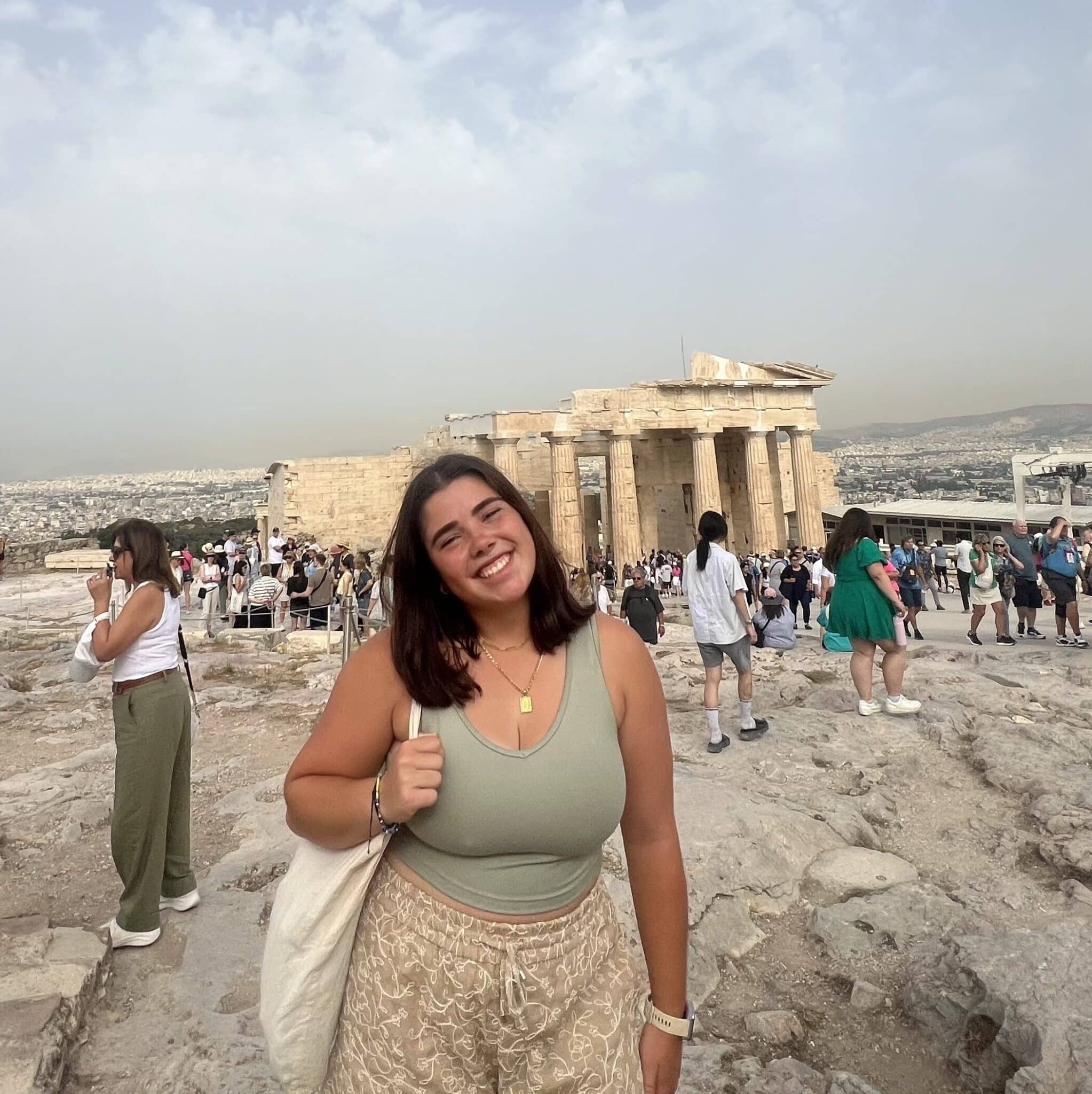 Woman standing in front of the Parthenon in Greece